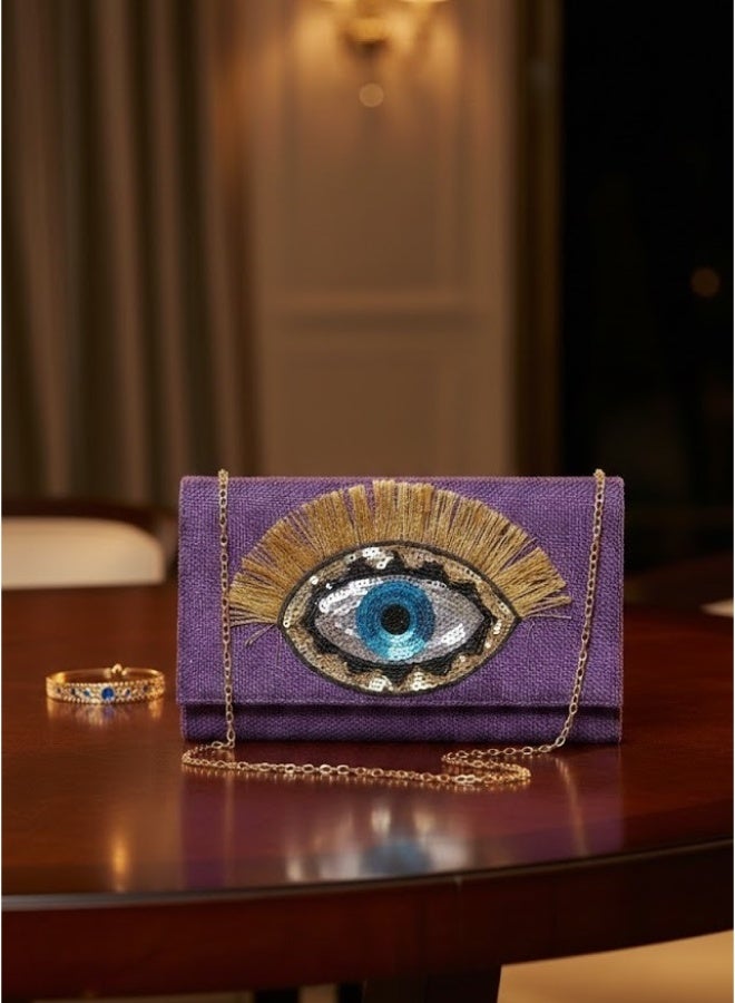 زوبا شنطة بورتفيه حريمي أنيقة بسلسلة ذهبية – تُلبس كروس أو كلتش – تصميم عين مميز وفخم للخروجات والمناسبات (لبنفسجي) - Image 1